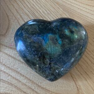 Labradorite heart that comes in a blue bag.